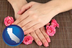 california map icon and a manicure (pink fingernails)