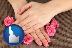 idaho map icon and a manicure (pink fingernails)