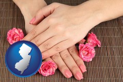 new-jersey map icon and a manicure (pink fingernails)