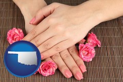 oklahoma map icon and a manicure (pink fingernails)