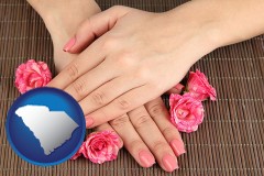 south-carolina map icon and a manicure (pink fingernails)